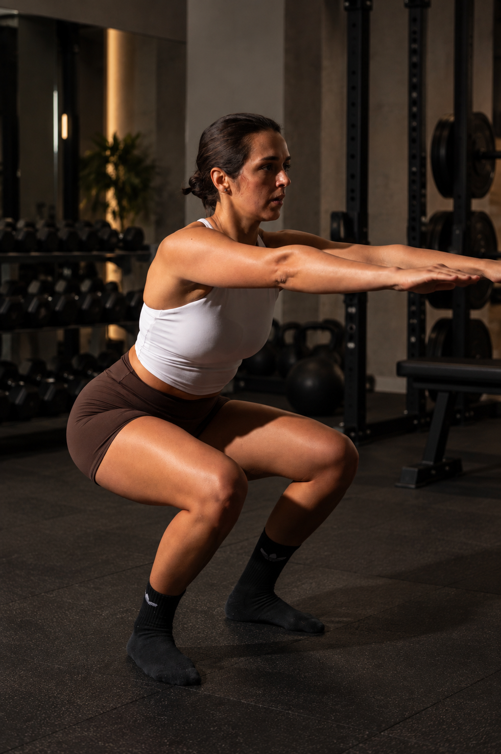 Jessie in a deep bodyweight squat, side profile